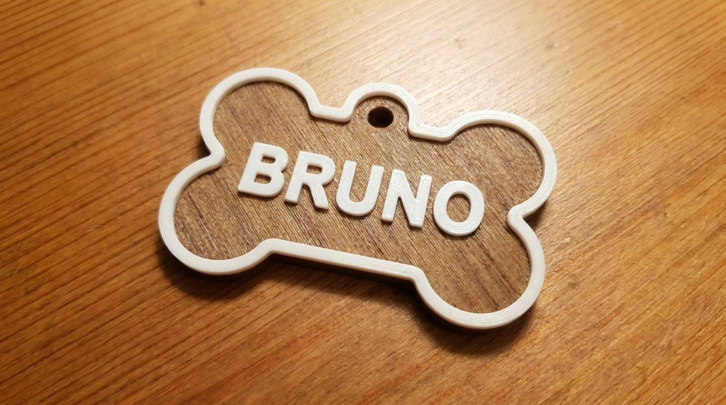 Colorful NFC pet tags in bone and round shapes — Zeus in blue, Chess and Leo in pink