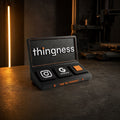 Thingness Social Tap Bar in matte black with Instagram, Google review and custom tiles on a dark studio counter