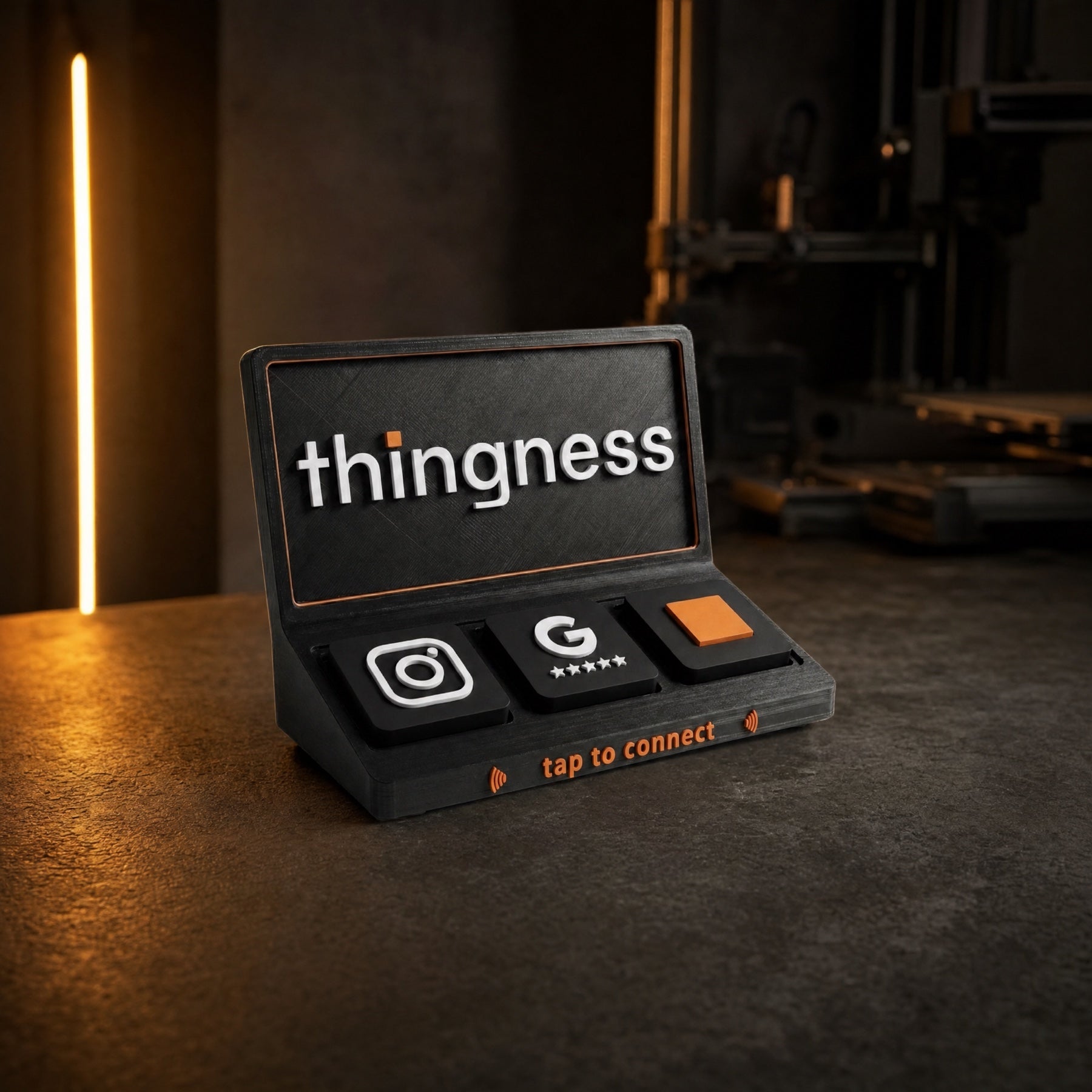 Thingness Social Tap Bar in matte black with Instagram, Google review and custom tiles on a dark studio counter