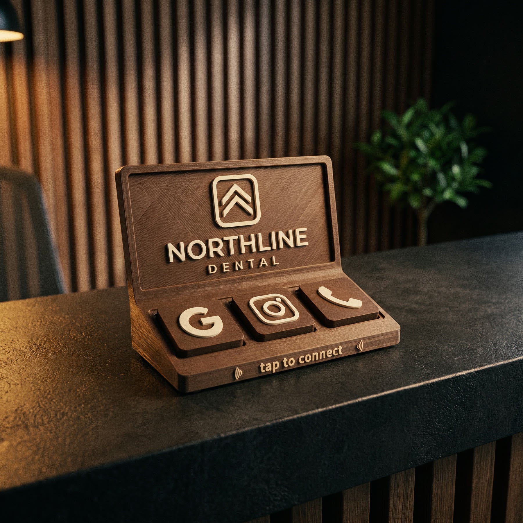 Social Tap Bar in warm walnut with a chevron mark on a dental clinic reception desk against a slatted wood wall